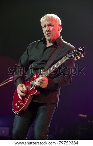 UNIVERSAL CITY, CA - JUNE 22: Alex Lifeson of the rock band Rush hits the stage for part of their Time Machine Tour at the Gibson Amphitheater in Universal City, CA on June 22, 2011.