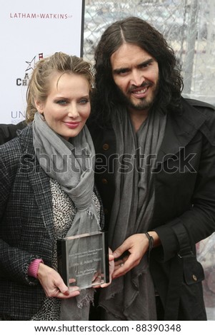 LOS ANGELES, CA - NOVEMBER 06: Russell Brand and Trina Venit arrive at A Day Of Champions Benefiting the Bogart Pediatric Cancer Research Program at Sports Museum of Los Angeles on November 6, 2011.