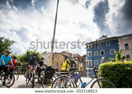 WACHAU VALLEY,AUSTRIA-MAY 9,2014:group of cyclists is resting at cycle path near danube river in Austria during a cloudy day