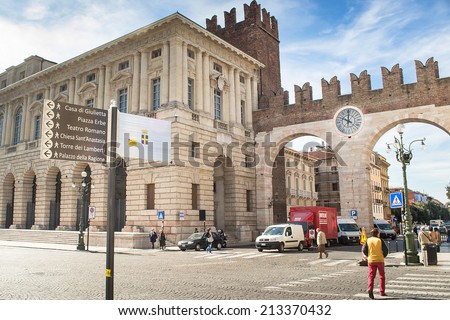 VERONA,ITALY-APRIL 26,2012:people and tourists  can follow the signs to the tourist attractions of Verona during a sunny day.
