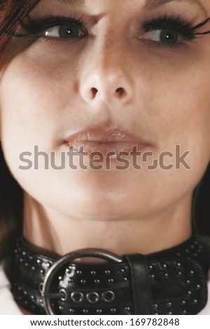 a woman\'s face filling the frame (focus is on the lips)
