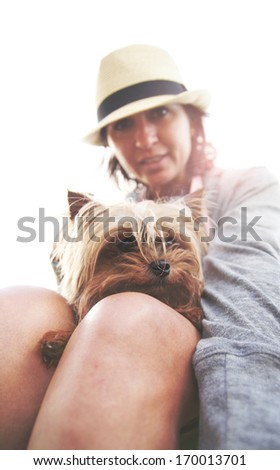 a woman and her tiny dog (shallow DOF on the dog\'s fur and nose)