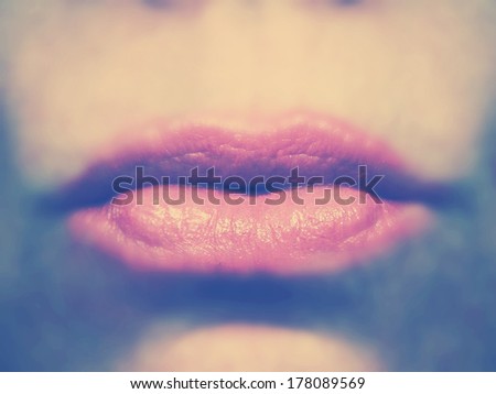 a close up shot of a woman\'s lips done with an instagram retro vintage filter
