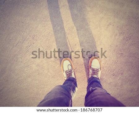a shot of yellow and white boat or deck shoes done with a retro vintage instagram filter