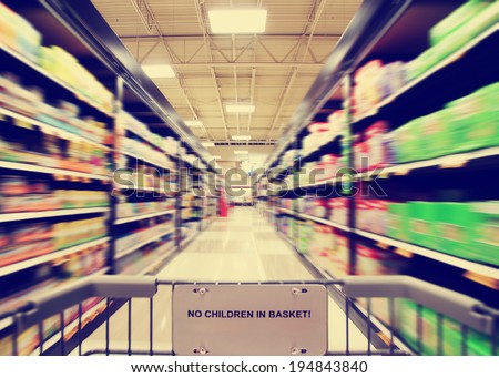 a blurred shot of an isle in a supermarket or grocery store shop done with a retro vintage instagram filter