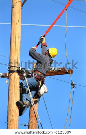 An Electrical Lineman Working On A Line Stock Photo 6123889 : Shutterstock