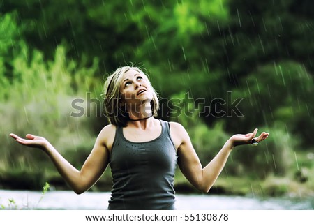 a pretty girl caught in a rain shower