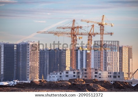 View of a large construction site with many tower cranes. New residential area of a big city ストックフォト © 