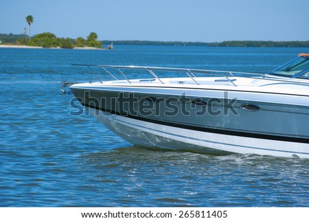 Boat bow of new boat idling through beautiful blue water