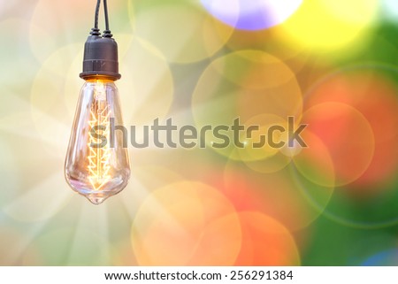 Lighting decor,bulb,The creative success Like a lamp with a beam of light on the background of beautiful bokeh.
