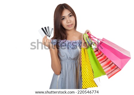 Beautiful Asian woman hold shopping bags show credit cards   isolated on white background