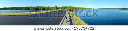 The road along summer lake (Finland). Panorama.