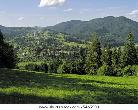 View from green meadow on mountain village (Slavske village, Carpathian Mt\'s, Ukraine)