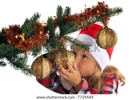 Small girl dress up Christmas tree (on light background - not isolated)