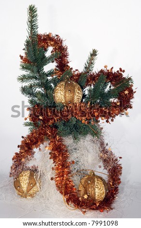 Christmas tree branch with adornments (on light background - not isolated)