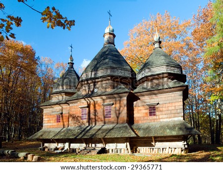 Ukrainian historical country wood church on forest edge in mountain