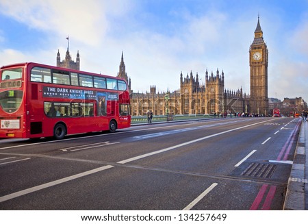 LONDON - DEC 21: Iconic London bus crossing Westminster Bridge in the United Kingdom December 21, 2009 in London, England