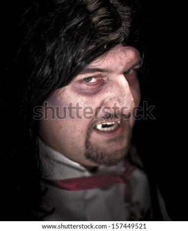 Man dressed in Halloween costume dressed as a vampire