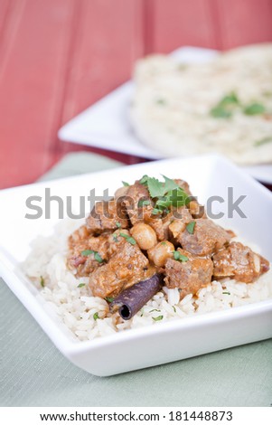 Beef curry served on a bed of rice
