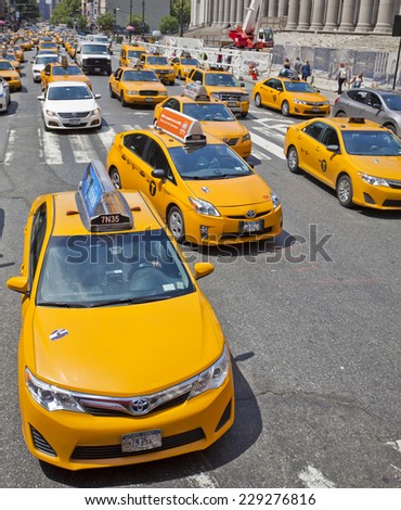 New York, USA - JUNE 28th, 2014: A crowded street full of iconic New York City taxi cabs