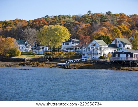 Beautiful New England colonial style homes on the water in fall