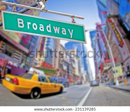 Colorful Broadway sign over Times Square background