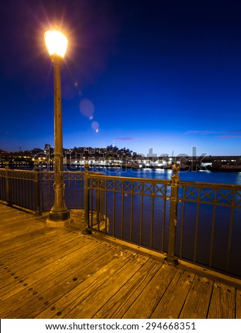 Pier 7 panorama in San Francisco at night with natural light flare