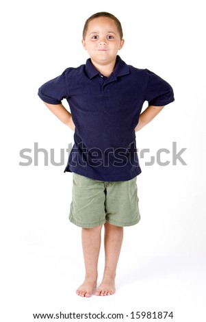 Happy Mixed Race Boy With Hands On Hips On White Background Stock Photo ...