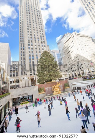 NEW YORK CITY - December 17: People enjoying Rockefeller Center Ice Skating at Christmas with the famous Christmas tree on December 17th, 2011 in New York City, New York.