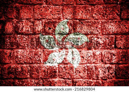Hong Kong flag painted on old brick wall