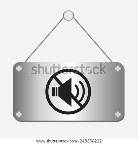 silver metallic no sound sign hanging on the wall