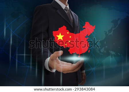 Businessman showing map of China on globe background