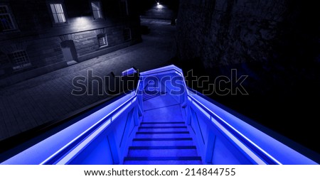 An illuminated staircase leads into the Royal William Yard in Plymouth, Devon. England.
