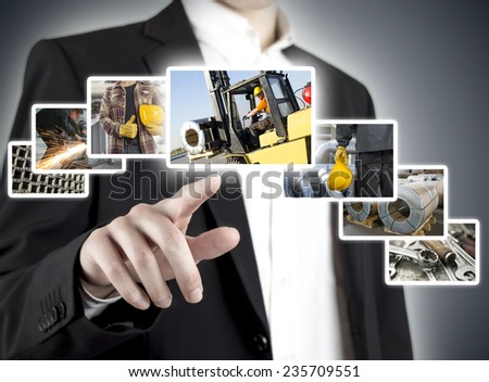 Businessman hand pressing touch screen with pictures of workers