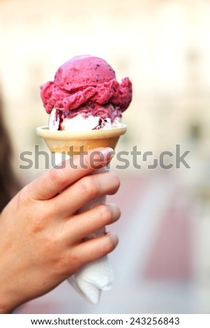 Melted Ice Cream in Waffle Cone in the Hand Isolated on White Background