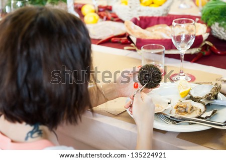 MOSCOW - APRIL 6: Unidentified people learn how to properly prepare and eat seafood at culinary master class \