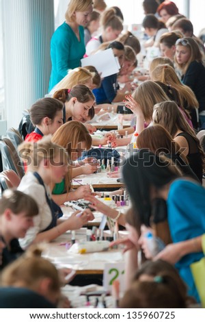 MOSCOW - APRIL 19: Unidentified orphan children, age 13-16, compete in manicure at the contest Young Master on April 19, 2013 in Moscow. Orphans were trained by charitable foundation Color of Life