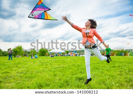 MOSCOW - MAY 25: Unidentified people fly kites at the kite festival in the park Tsaritsyno on May 25, 2013 in Moscow.