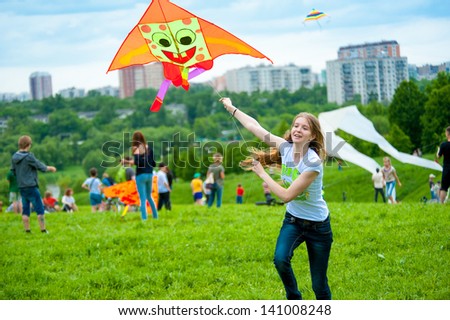MOSCOW - MAY 25: Unidentified child flies kite at the kite festival in the park Tsaritsyno on May 25, 2013 in Moscow.