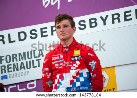 MOSCOW - JUNE 23: Oliver Rowland of Manor MP Motorsport team (NED) gets a reward for winning at Formula Renault 2.0 race at World Series by Renault in Moscow Raceway on June 23, 2013 in Moscow