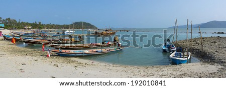 SAMUI, THAILAND - MARCH 27: Fishing boats moored at the shore on March 27, 2014 in Samui, Thailand. Fishing is one of the main activities of the locals in Thailand