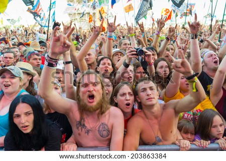 BIG ZAVIDOVO, RUSSIA - JULY 4: People cheering at open-air rock festival \