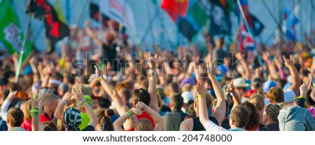 BIG ZAVIDOVO, RUSSIA - JULY 5: People cheering at open-air rock festival 