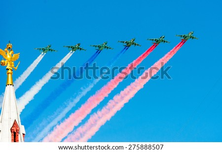 MOSCOW - MAY 7: Fighters do smoke in colors of Russian flag at last rehearsal of the parade dedicated to 70th anniversary of the victory in the Second World War in Red Square on May 7, 2015 in Moscow