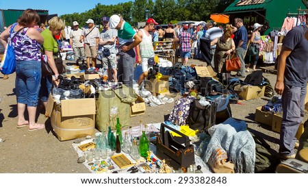 MOSCOW - JULY 04: People buy and sell used items at a flea market \