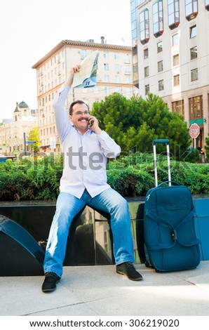 Businessman waving city map to someone. He is glad to meet
