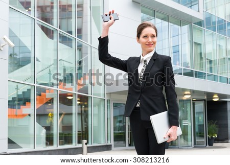 Young business woman waving hand