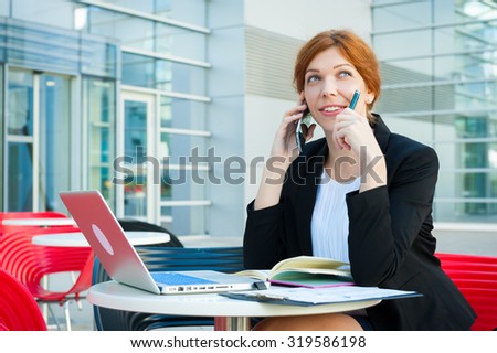 Young business woman thinking portrait