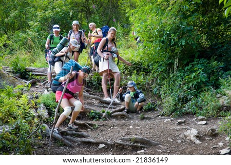 Hikers go down on a stony track