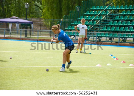 SUMY, UKRAINE - JUNE 28: A Girls bandy (hockey) team trains in a stadium on June 28, 2010 in Sumy, Ukraine